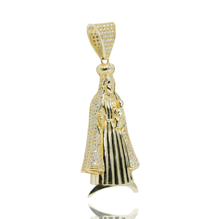 The Lady of Charity Pendant – 10K Gold with CZ Stones is a men’s pendant shaped like a crowned figure holding a child, adorned with sparkling CZ stones and featuring a large, textured bail for your favorite chain.