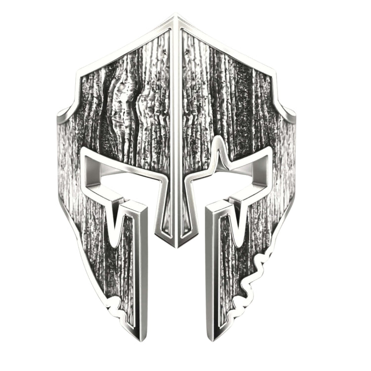 The Bold Spartan Warrior Helmet Ring-14k Gold features a stylized metallic helmet with a textured, weathered wood-like pattern, bold angular lines, and prominent cheek guards—ideal for standout men's jewelry or a striking Spartan ring.