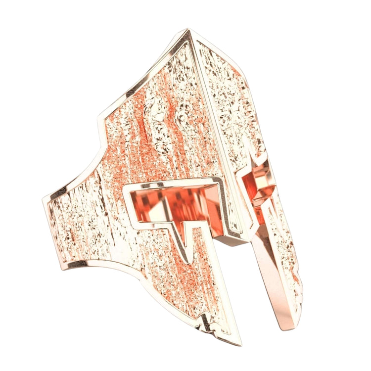 The Bold Spartan Warrior Helmet Ring-14k Gold is a men's ring shaped like a Spartan helmet with textured details and angular eye cutouts, offering a striking and bold jewelry statement.