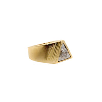The All Seeing Eye Ring in Solid Gold is a men's ring with a geometric, angular design, featuring diagonal grooves and a round diamond set in a triangular side accent on a white background.