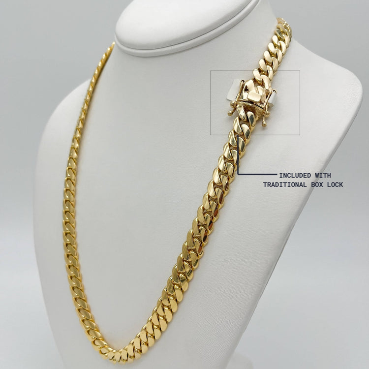The 8mm Cuban Link Chain 22k Solid Gold is displayed on a mannequin, emphasizing its bold design and timeless elegance.