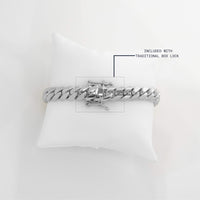 The Silver Cuban Link Bracelet - 16mm is elegantly displayed on a white pillow.