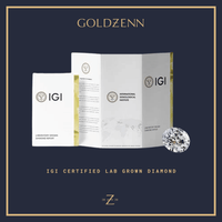 The Elegant Tapered Band Lab Diamond Engagement Ring, IGI certification booklet, and lab report are shown on a dark blue background with the GOLDZENN logo and "IGI Certified Lab Grown Diamond" text at the bottom.