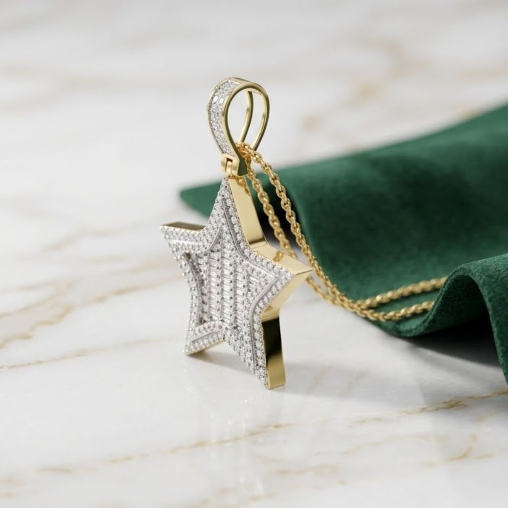 The 14K Gold Diamond Star Charm Pendant 3/4 CTTW, crafted in yellow gold and adorned with sparkling diamonds, is displayed on a gold chain resting atop marble beside a folded green cloth.