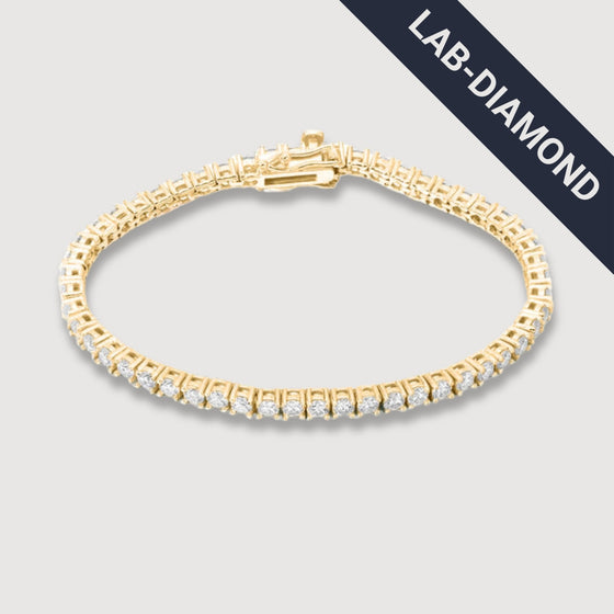 14k Gold Tennis Bracelet with Lab Grown Diamonds14K gold tennis bracelet featuring E-F VS lab-grown diamonds. Ethically crafted for timeless style. Available in yellow, white, or rose gold.