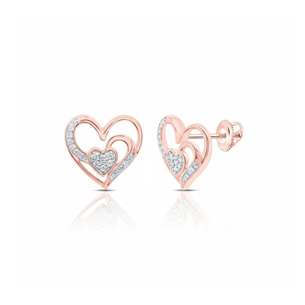 The 1/10 CTW Natural Diamond Heart Earrings are crafted in 10k gold, featuring open heart shapes with pave diamond-filled inner hearts, shown on a white background with a subtle reflection.