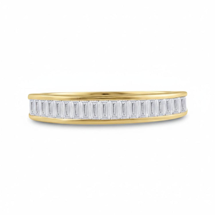The 10k Yellow Gold Baguette Diamond Wedding Band 1/2 Cttw showcases a row of vertically set rectangular baguette diamonds along the sleek band in a modern design, shown against a plain white background.