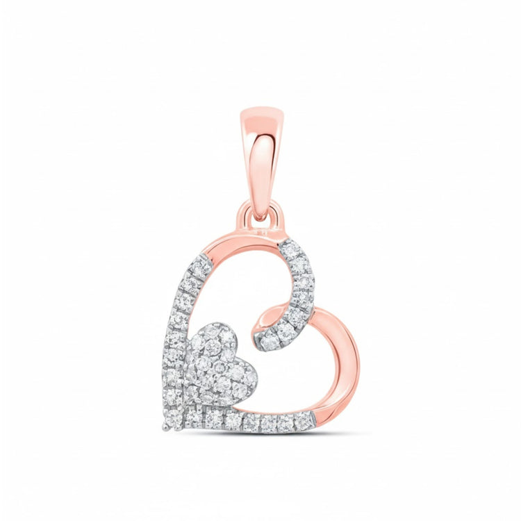 This 10K Gold Diamond Heart Pendant (1/10 CTW) features a rose gold heart outline, partially set with diamonds, and a smaller diamond heart cluster inside. The bail is also rose gold—a stunning piece for any collection.