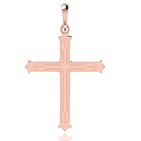 The 14k Gold Decorative Cross Pendant features subtle engraved lines, pointed tips, a smooth reflective finish, and a top loop for attaching to a necklace chain.