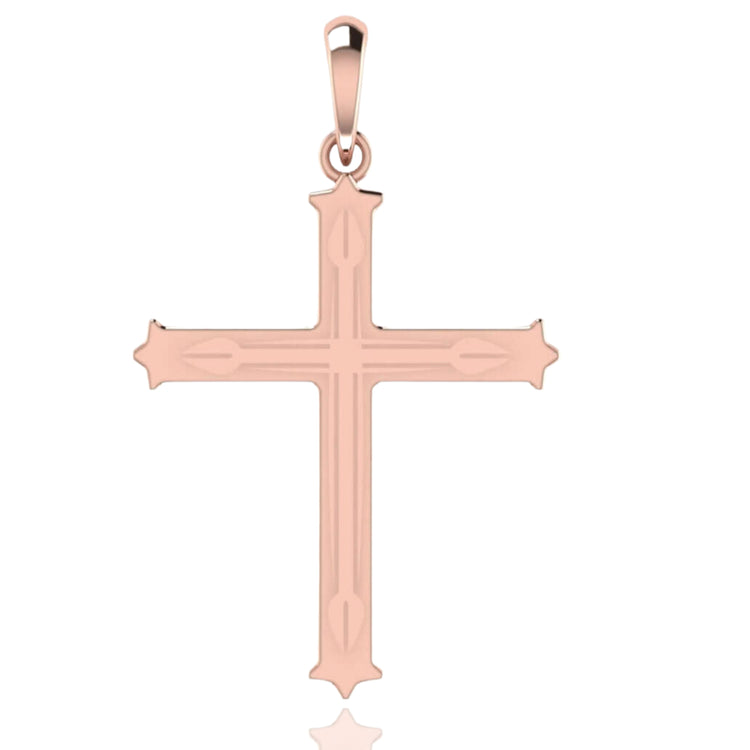 The 14k Gold Decorative Cross Pendant features subtle engraved lines, pointed tips, a smooth reflective finish, and a top loop for attaching to a necklace chain.