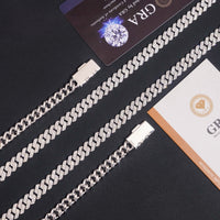 Three Moissanite Cuban Links Chain 8mm - 925 Sterling Silver pieces are displayed on a black surface, accompanied by two certification cards with diamond graphics and official text.