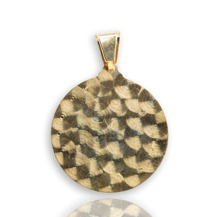 The Saint Lazarus Circular Pendant is a 14K solid gold men’s pendant featuring a hammered, textured round design with a simple gold bail, shown against a white background with a subtle reflection below.