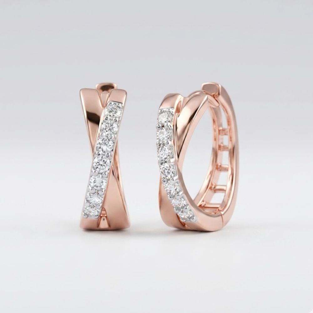 Experience timeless elegance with the 10k Gold Round Diamond Hoop Earrings – 1/6 Cttw, featuring a stylish crisscross design and a row of sparkling diamonds reminiscent of classic hoop earrings.