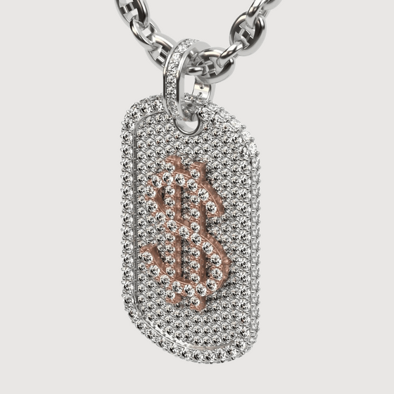 Luxurious 14K gold dog tag pendant with encrusted diamond dollar sign, showcasing opulence and style.