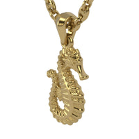 Close-up of the 14k Gold Seahorse Pendant featuring intricate ridges and textures, shown on a matching gold chain against a white background—a beautiful piece of seahorse jewelry.