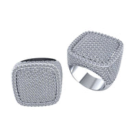 The Iced Cushion Diamond Ring – 6.48 CT Pavé Design is shown against a white background, with one square-shaped silver ring facing up and the other tilted to display its diamond-studded band.