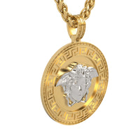 A gold chain necklace with a 14k Two-Tone Gold Medusa Pendant, showcasing a raised silver Medusa head at the center and surrounded by a classic Greek key border.