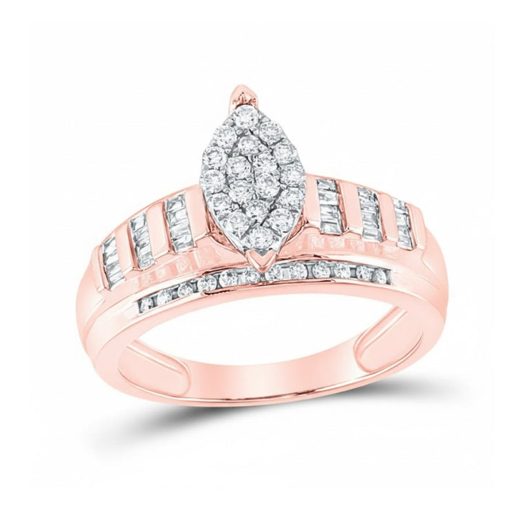 The 10k Gold Oval Diamond Cluster Bridal Ring 1/2 Cttw features an oval diamond cluster at the center, with rows of baguette and round diamonds set into the rose gold band for added sparkle.
