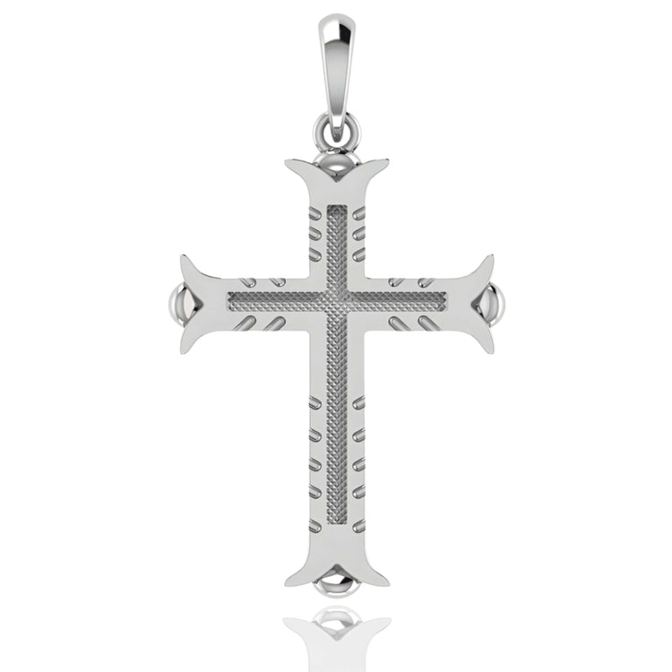 The 14k Gold Ornate Cross Pendant features pointed, flared ends, a textured center, grooved arm details, and a polished bail for easy attachment to a necklace.