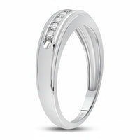 The 10k White Gold Round Diamond Wedding Band 1/4 Cttw features three small, round diamonds set in a smooth, slightly curved band, shown against a plain white background.