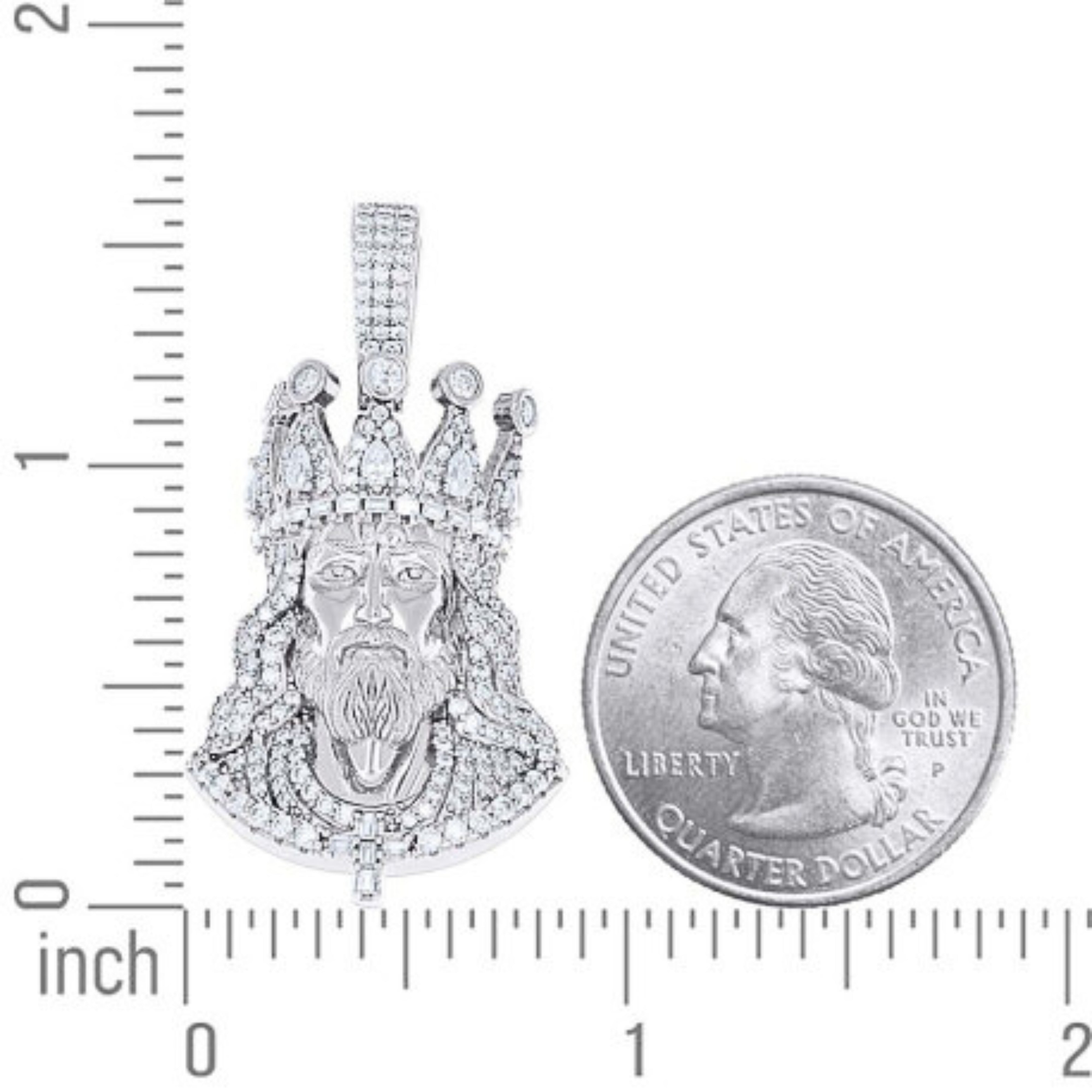 The Men’s Moissanite Jesus Pendant in 925 silver is shown next to a U.S. quarter for size reference, with both resting on a surface marked with inch ruler measurements.