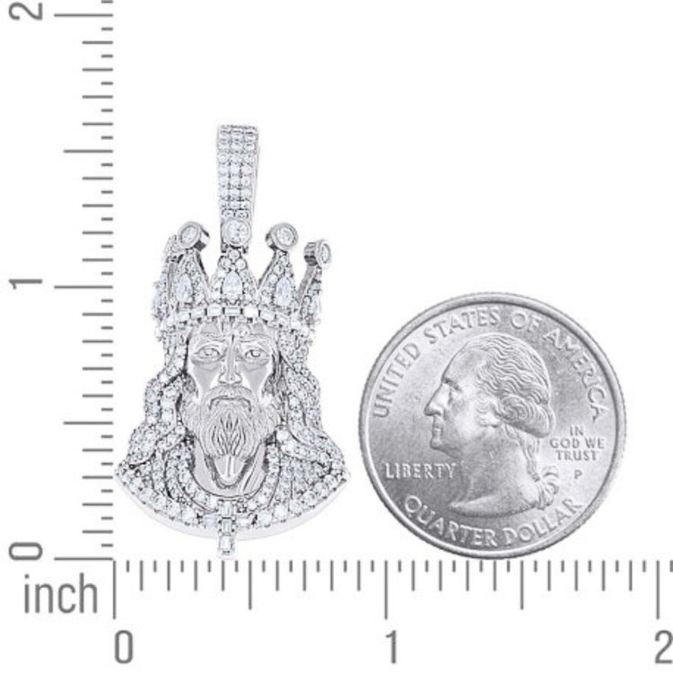 The Men’s Moissanite Jesus Pendant in 925 silver is shown next to a U.S. quarter for size reference, with both resting on a surface marked with inch ruler measurements.