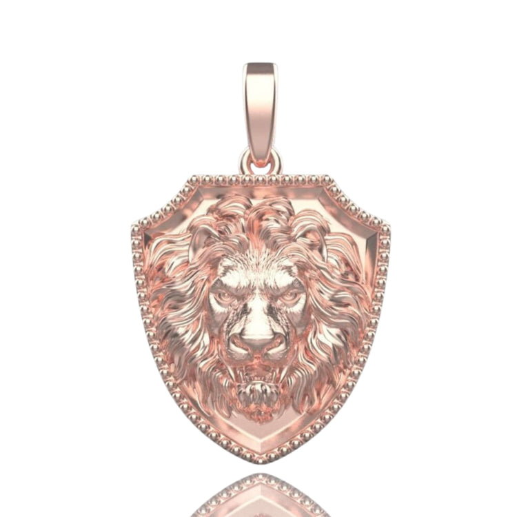 The 14k Gold Lion Shield Pendant has a rose gold shield and detailed lion’s head center, with a loop for easy attachment—an eye-catching necklace piece for any collection.