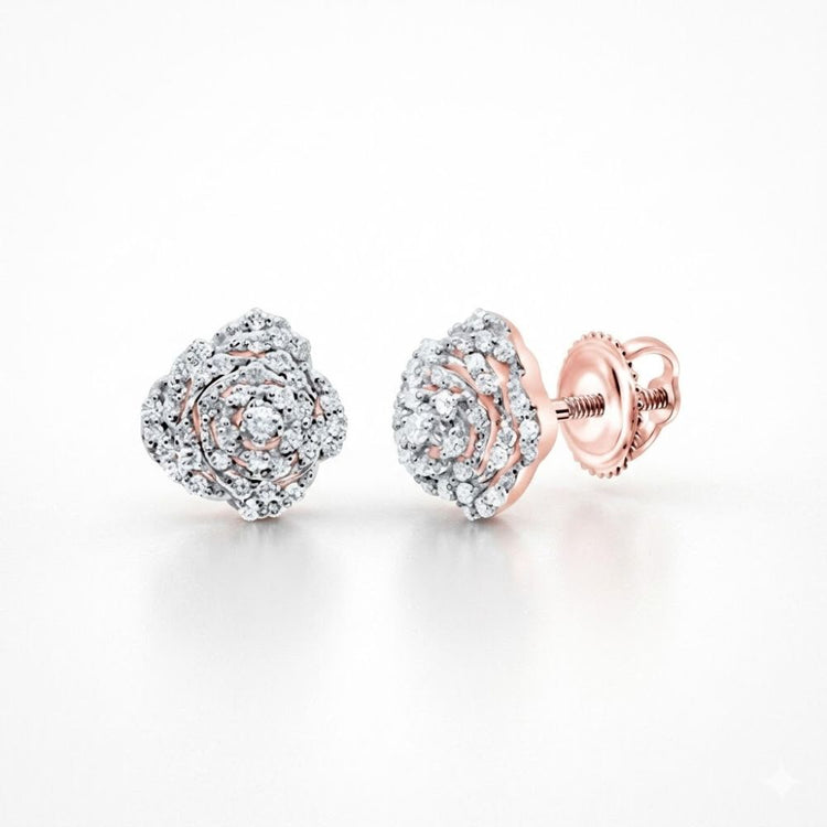 The 1/5CTW Natural Diamond Rose Earrings 10K Gold feature rose-shaped studs with sparkling natural diamonds in a spiral design and secure 10k gold screw-back posts, shown on a white background.