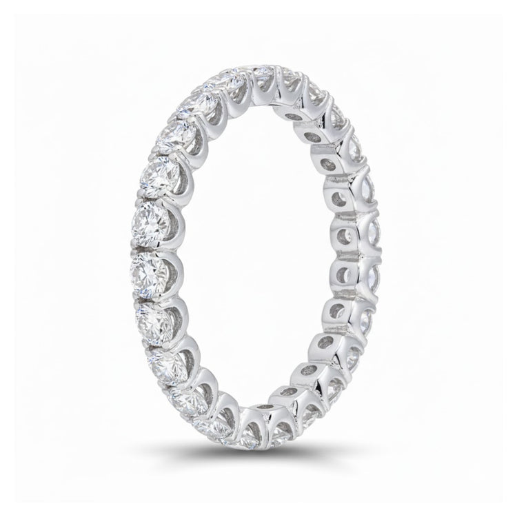 The 14k White Gold Diamond Eternity Ring 2 Cttw features round brilliant-cut diamonds encircling the band, shown upright against a white background.