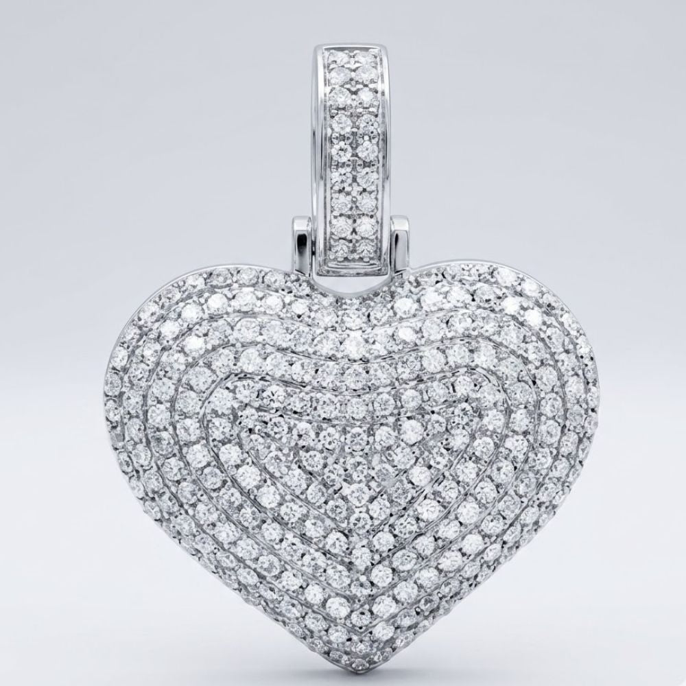 The 10K Gold Diamond Heart Pendant 3/4 Cttw Charm, set with rows of sparkling diamonds, shines elegantly against a plain light gray background.