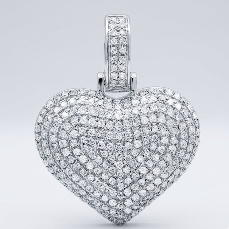 The 10K Gold Diamond Heart Pendant 3/4 Cttw Charm, set with rows of sparkling diamonds, shines elegantly against a plain light gray background.