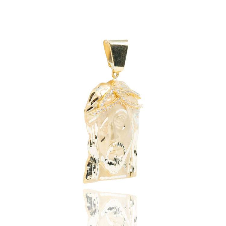 The Jesus Piece Pendant in 10K Gold is a polished men’s gold pendant shaped like a face with a crown of thorns, making it a striking and meaningful accessory.