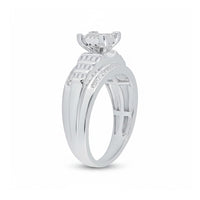 The Sterling Silver Diamond Cluster Bridal Engagement Ring features a raised prong setting with a round diamond, geometric details, and accent stones along the band for a stunning bridal look.