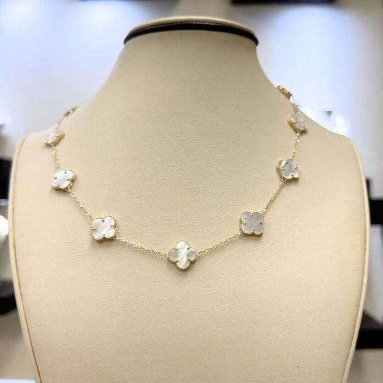 White Four Leaf Clover Necklace - 14k Yellow Gold Elegant 14k yellow gold necklace with a luminous white four leaf clover pendant. A symbol of luck and delicate beauty. Shop the White Clover Necklace today!