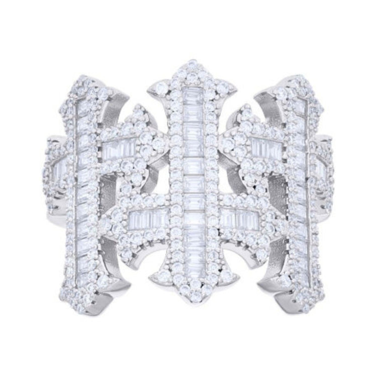 The Baguette Moissanite Cross Religious Ring is a wide silver band with an ornate geometric design, featuring rows of baguette-cut moissanite and round diamonds set in symmetrical, cross-inspired patterns.