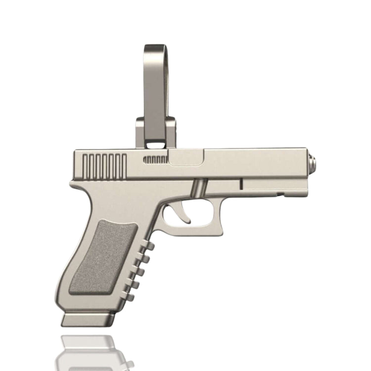 The 14k Gold Pistol Pendant is a detailed, reflective handgun-shaped piece with a top loop for attaching to a chain, capturing the realistic features of a semi-automatic pistol.