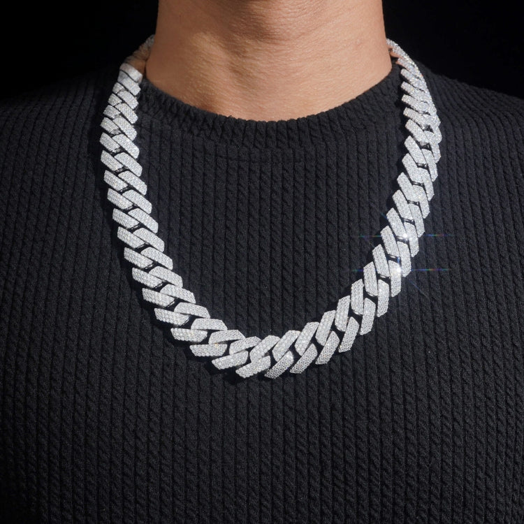 A person wearing a Moissanite Cuban Links Chain 20mm made from 925 sterling silver.