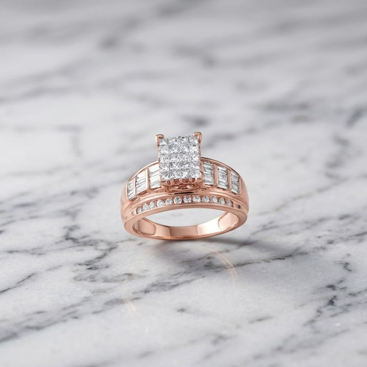 The 10k Gold Princess Diamond Bridal Engagement Ring 1 Cttw features a stunning princess diamond cluster with sparkling diamond accents on the band, beautifully displayed on a white marble surface.