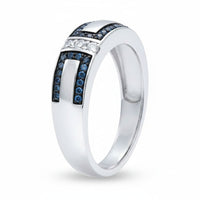 The Sterling Silver Blue Diamond Wedding Band – 1/5 Cttw features two rows of blue stones and a central row of clear stones in a modern geometric design, creating a chic stackable accent ring perfect for any occasion.