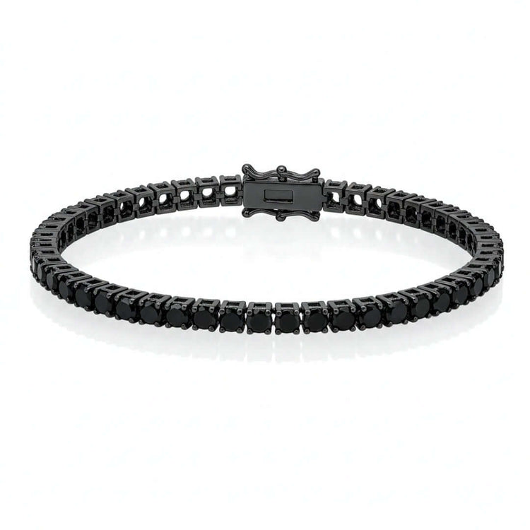 The Black Moissanite Tennis Bracelet showcases a continuous row of round black stones set in dark 925 sterling silver, all displayed on a white background.