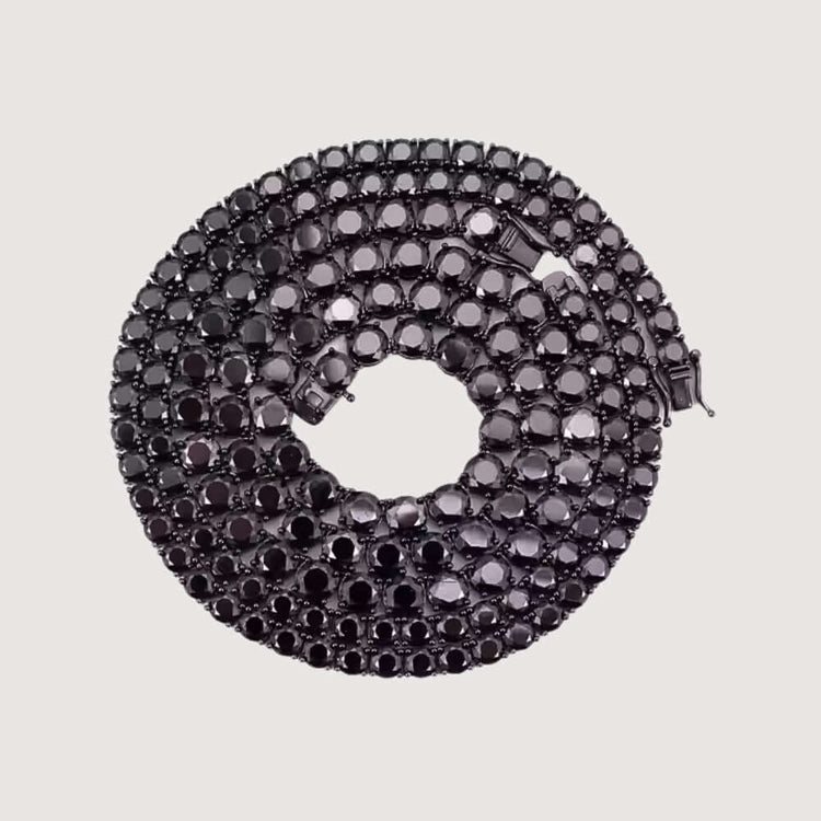 The Black Moissanite Tennis Chain - 3mm features multiple rows of faceted, round black moissanite stones set in coiled metal, showcased against a plain light background.