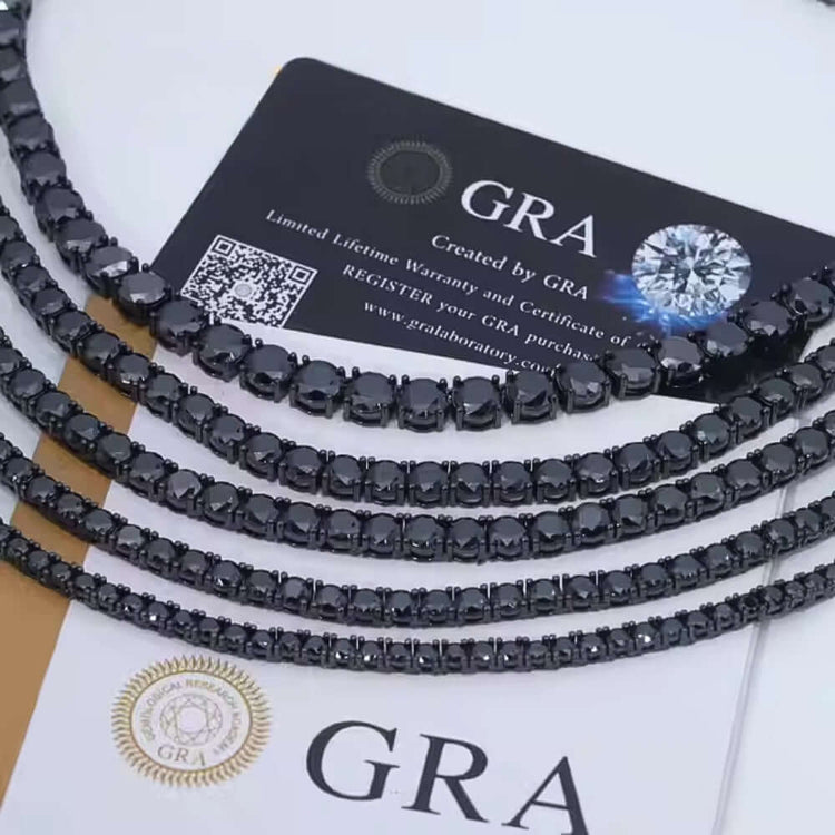 Close-up of Black Moissanite Tennis Chain - 3mm displayed on GRA certification cards with QR code and authenticity seal. The necklace features a sleek, shiny, modern look.