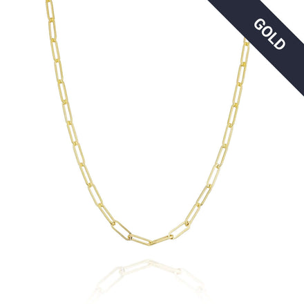 The Gold Paper Clip Chain - 4mm, a minimalist necklace with elongated links, is shown on a white background with a dark diagonal banner in the top right corner that reads GOLD in white letters.