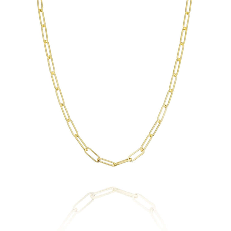 The Gold Paper Clip Chain - 4mm is a delicate gold necklace with elongated rectangular links, shown on a white background with its reflection. This minimalist piece adds everyday elegance to any outfit.