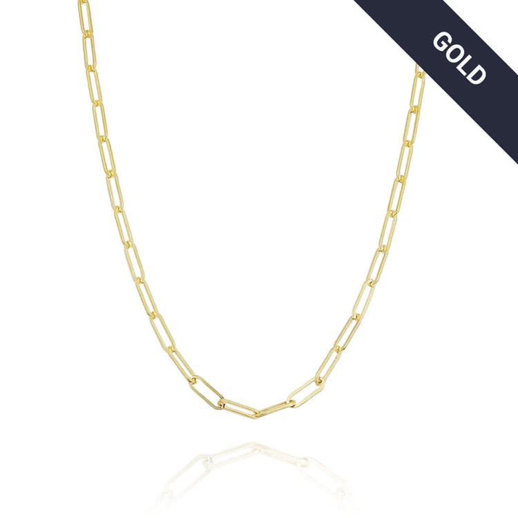 The Gold Paper Clip Chain - 4mm, a minimalist necklace with elongated links, is shown on a white background with a dark diagonal banner in the top right corner that reads GOLD in white letters.