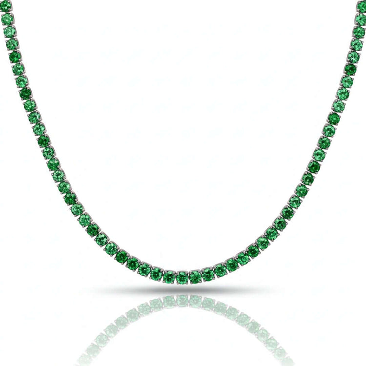 The Green Moissanite Tennis Chain - 3mm features a single strand of closely set round green moissanite gemstones in a continuous line, displayed on a white background with a subtle reflection below.