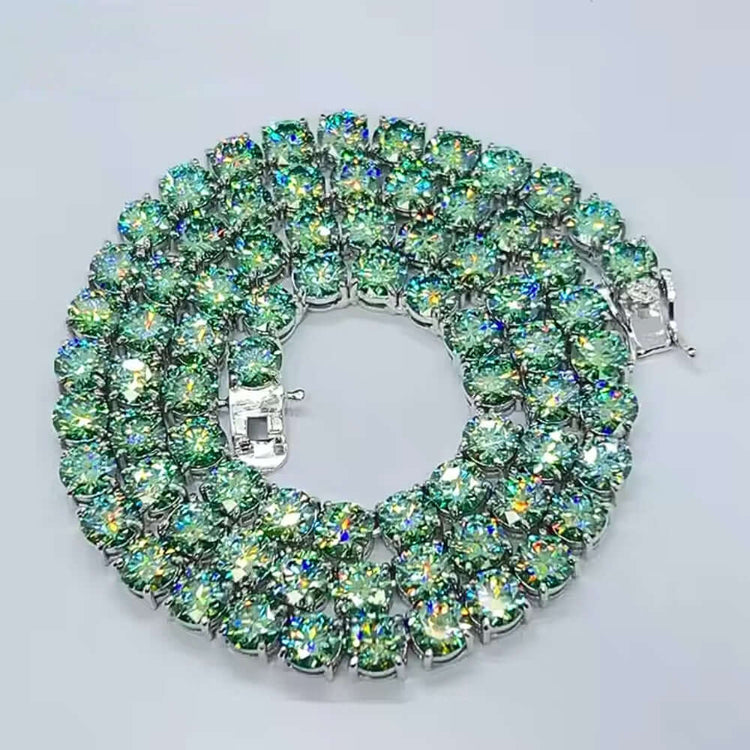 The Green Moissanite Tennis Chain - 4mm features three rows of large, round, sparkling light green stones that reflect rainbow hues, reminiscent of a coiled silver bracelet, shown on a plain white background.