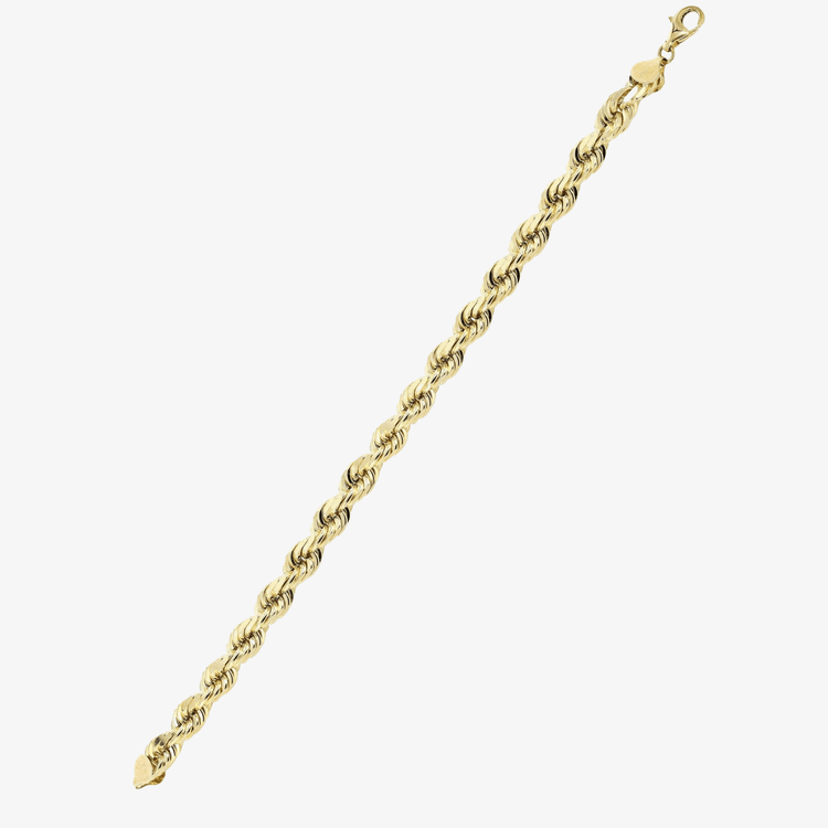 The Gold Rope Bracelet - 4mm is crafted in 14k gold with a lobster clasp. Its twisted links offer a textured, elegant Miami-inspired look and it's shown diagonally on a white background.