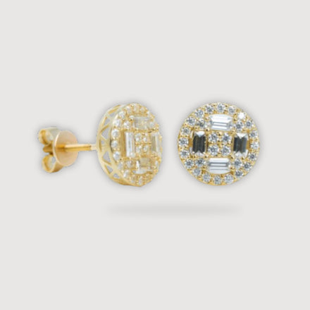 The 4 Side Moissanite Stud Earrings in 10K yellow gold feature a round shape with geometric patterns, small moissanite gems, and baguette-cut stones, shown on a light gray background.