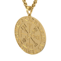 The 14k Gold Viking Pendant features engraved runes along its edge, a central compass-like design, and hangs from a twisted gold chain—a bold statement piece of Norse jewelry.